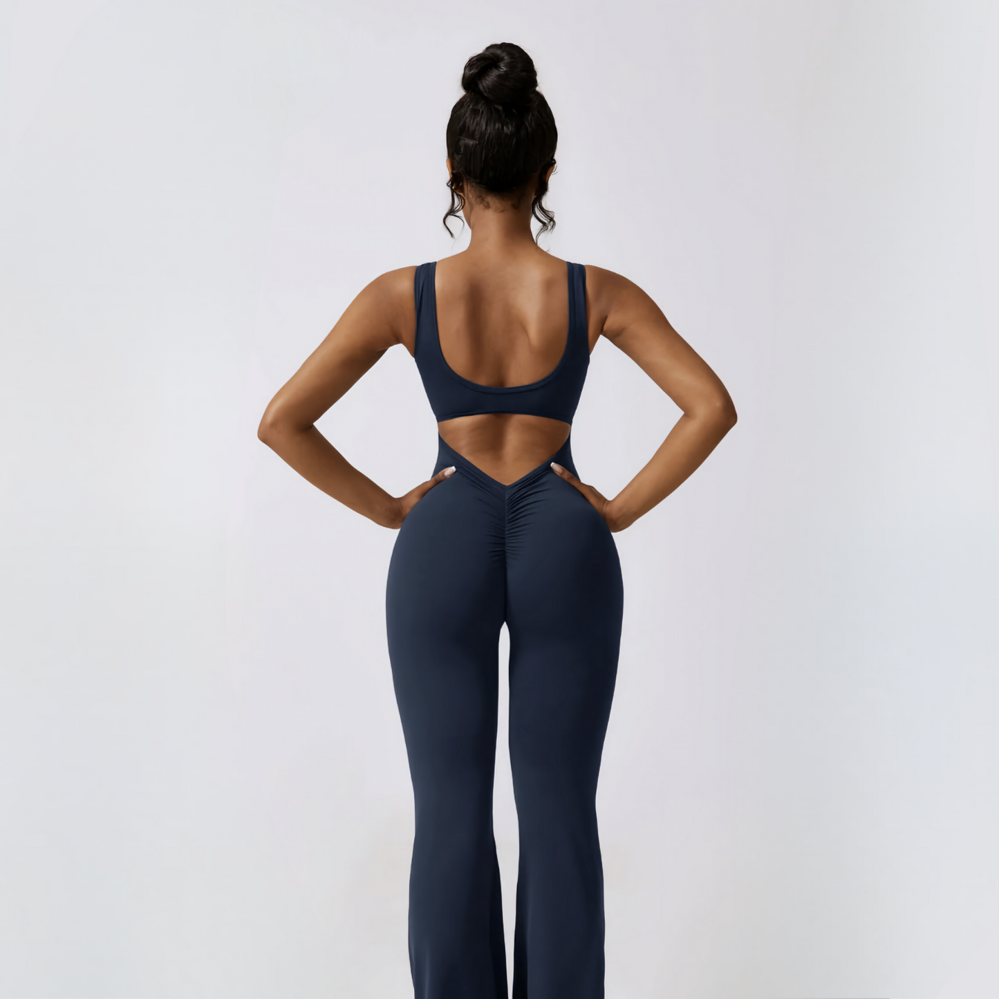 Back photograph of fitness model showcasing the ruching and butt enhancing details of the Samara Jumpsuit from Vibras Activewear.
