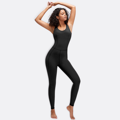 Model stretching in a sexy,  squat proof, black jumpsuit from Vibras Activewear