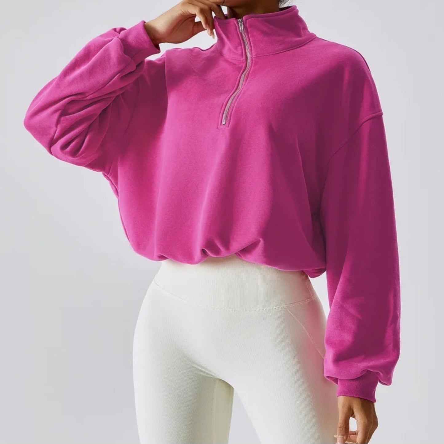 FITNESS MODEL WEARING A  HOT BARBIE PINK, CROPPED, PAPER BAG SWEAT SHIRT FROM VIBRAS ACTIVEWEAR.