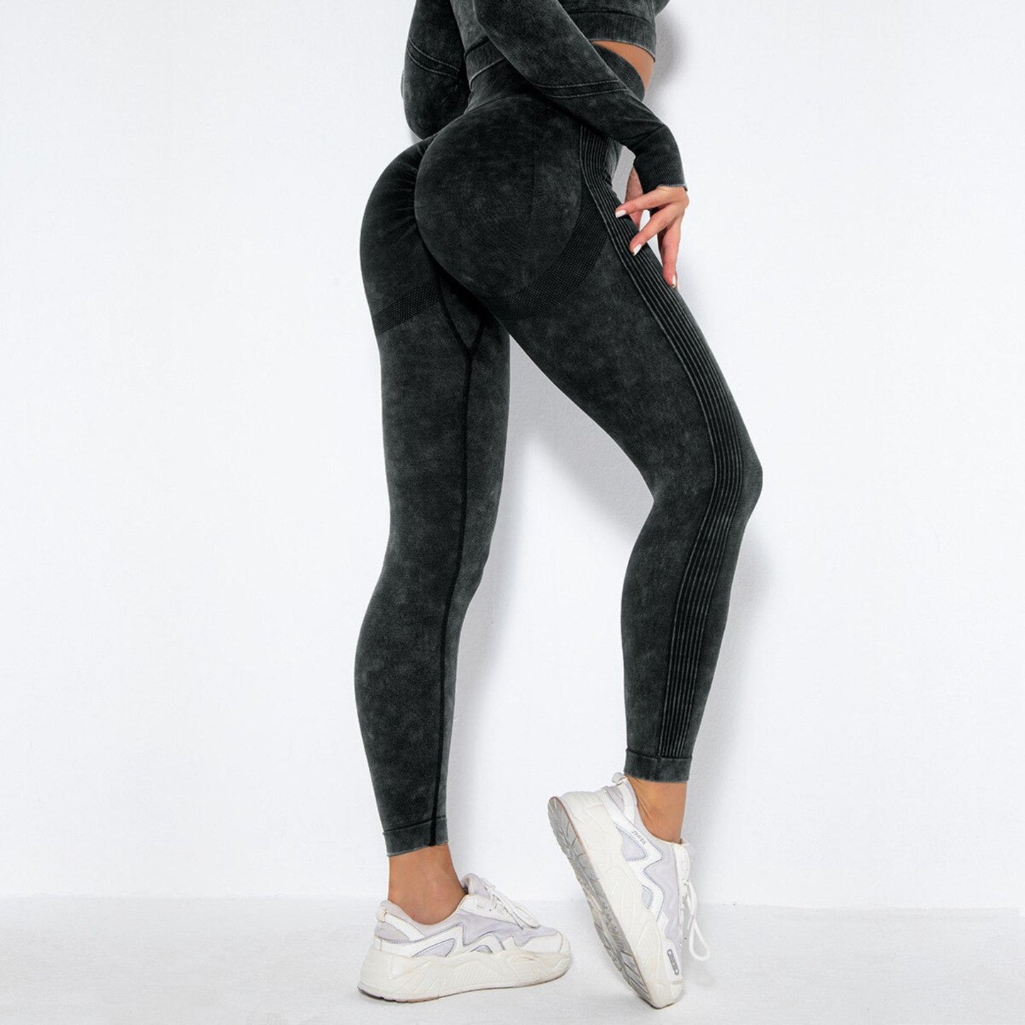 fitness female model wearing a black acid wash workout leggings that outline the booty well from Vibras Activewear