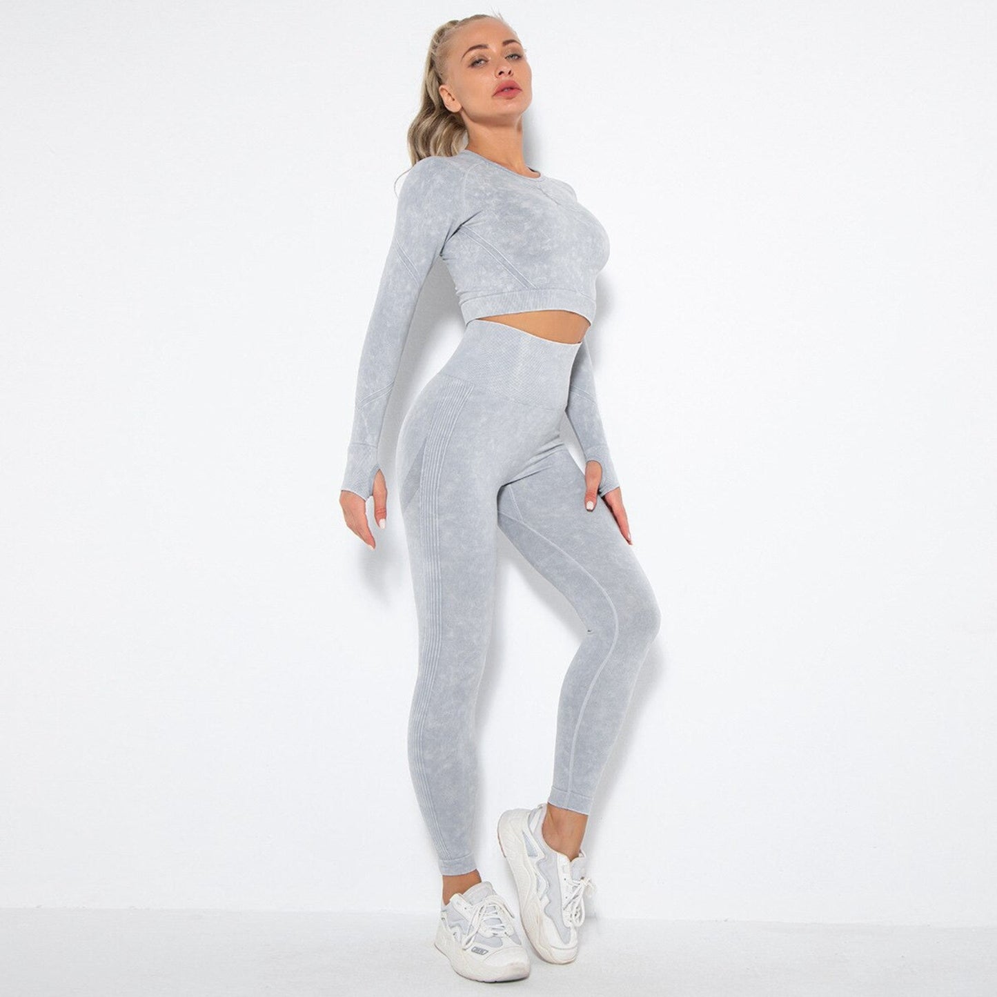 Model wearing gray contouring matching suit from Vibras Activewear.