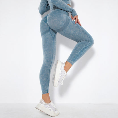 fitness female model wearing deep blue acid wash workout leggings that outline the booty well from Vibras Activewear