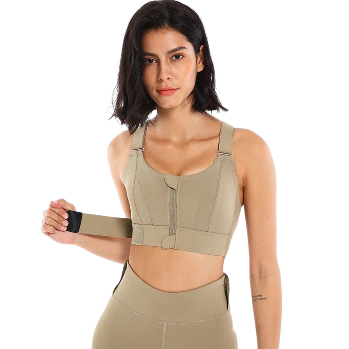 Female adjusting a caramel high impact sport bra on her body from vibras activewear