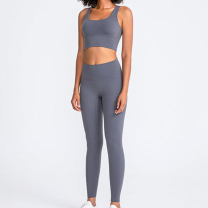 Side shot of model wearing a charcoal coloured activewear matching set  from Vibras Activewear