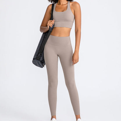 Fitness model wearing a tan coloured activewear matching set  from Vibras Activewear