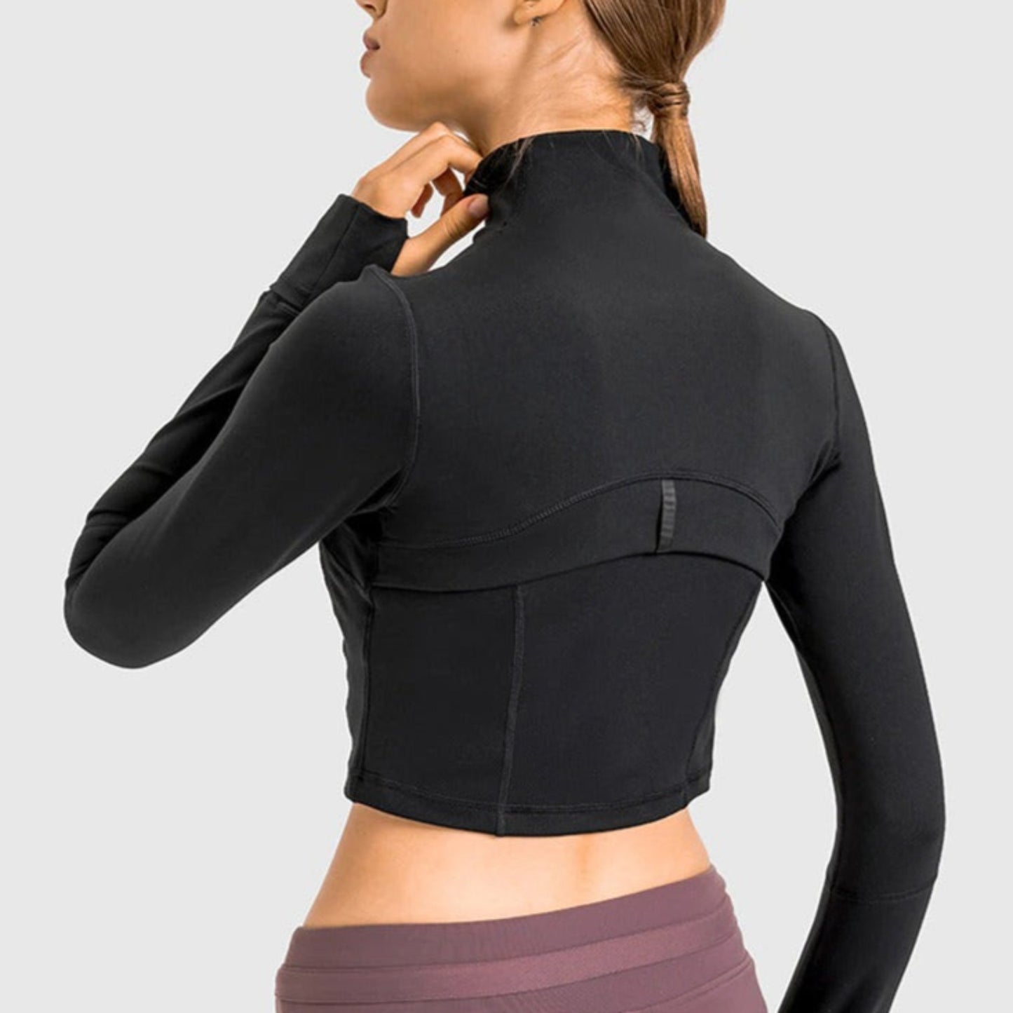 back shot of Model wearing deep black Crop Jacket from Vibras Activewear.